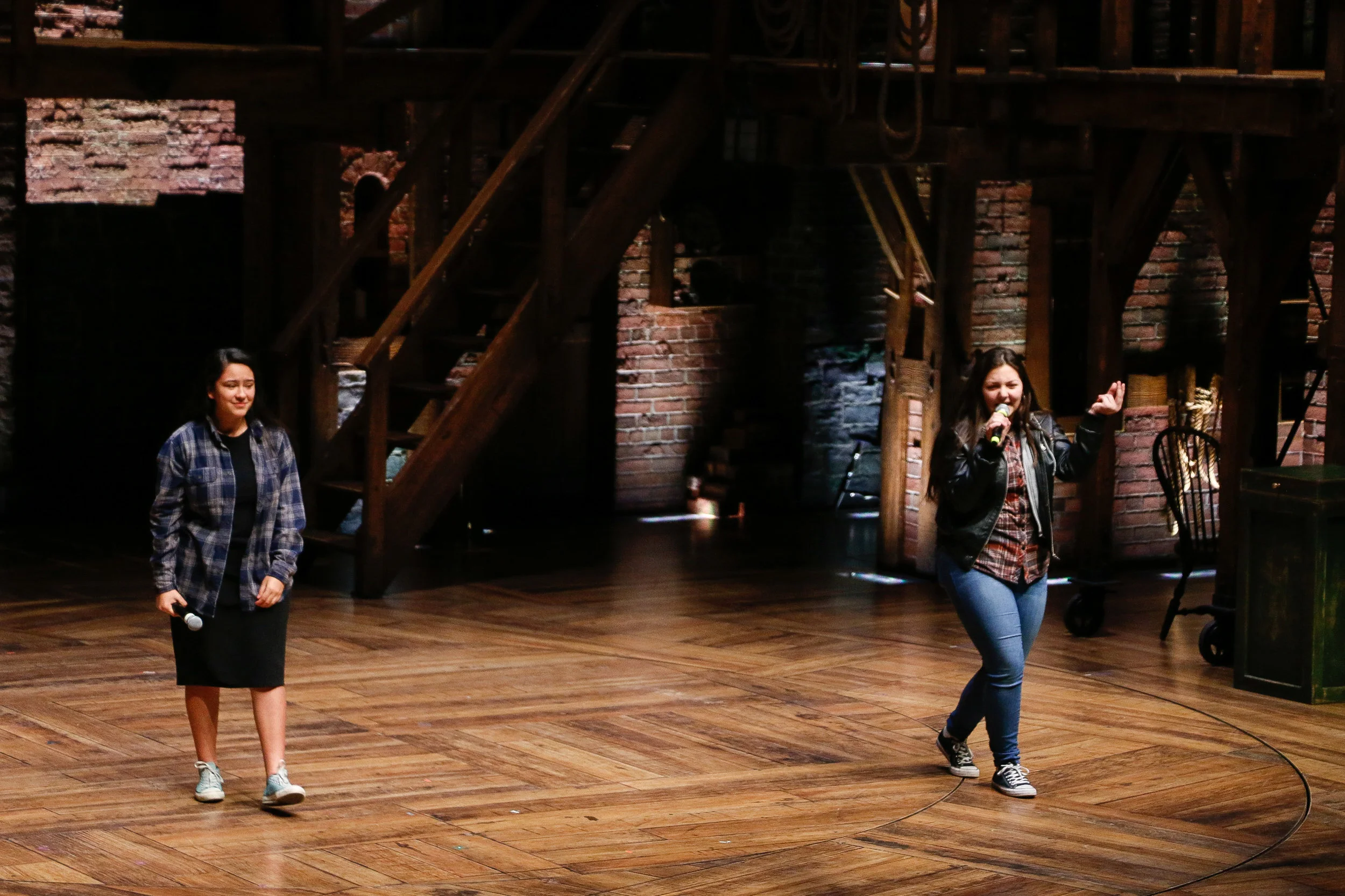 Juniors Itzeel Rivera and Betsy Muniz of United Township High School performing at CIBC as part of The Hamilton Education Program. Photo by Mary Crylen.