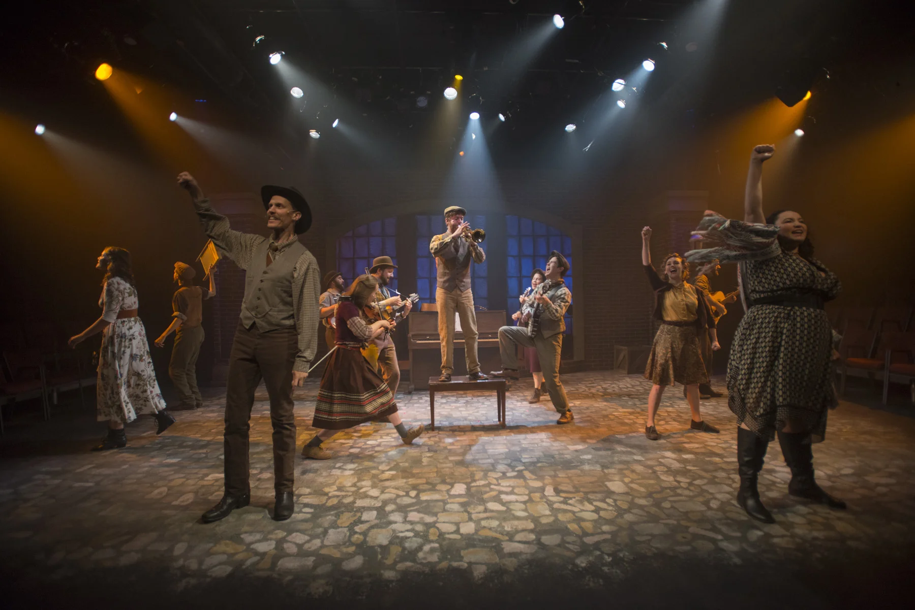 (left to right) Amanda Giles , Joey Harbert , Erik Pearson , Eric Loughlin, Elleon Dobias , Mike Mazzocca , T.J. Anderson , Sarah Beth Tanner , Kelan M. Smith , Melanie Vitaterna , Josiah Robinson and Bridget Adams-King in Underscore Theatre Company and The Den Theatre’s new musical HAYMARKET . Photo by Michael Brosilow.