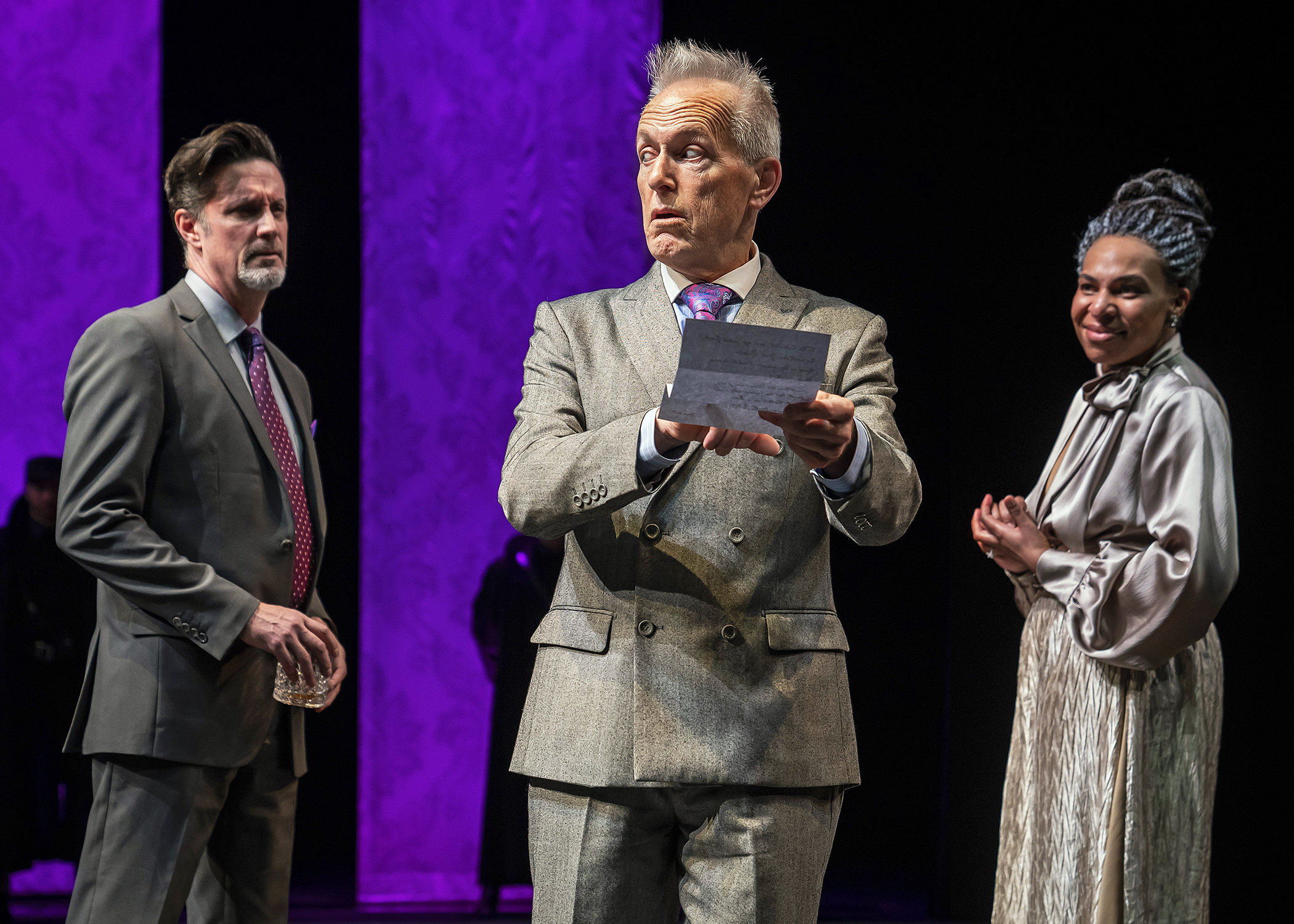 Polonius (Larry Yando, at center) reveals to King Claudius (Tim Decker) and Queen Gertrude (Karen Aldridge) the contents of Hamlet’s letter to Ophelia in Chicago Shakespeare Theater’s production of Hamlet , directed by Barbara Gaines, in the Courtyard Theater, April 17–June 9, 2019. Photo by Liz Lauren.