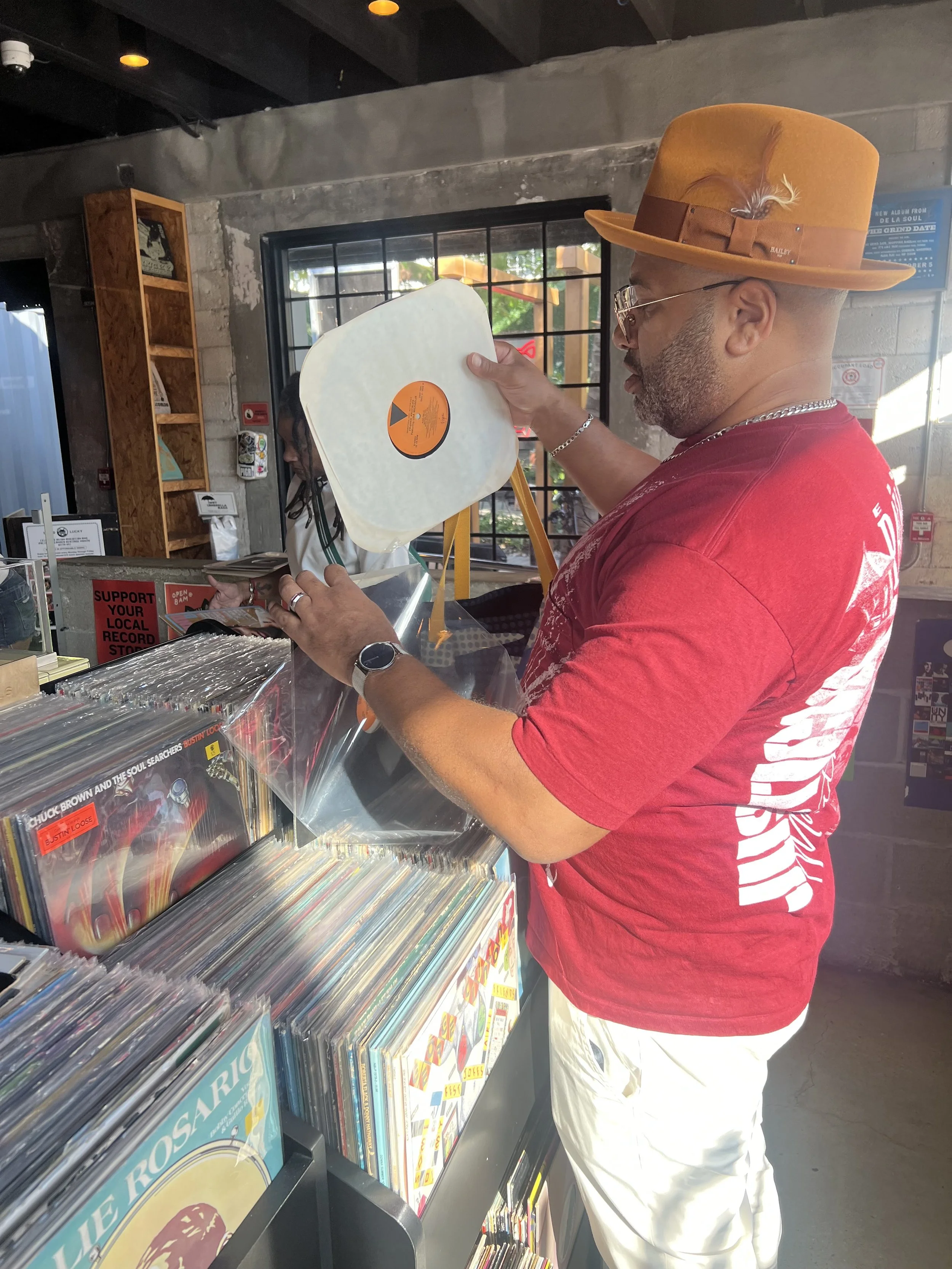 DJ digging for Records with Hat