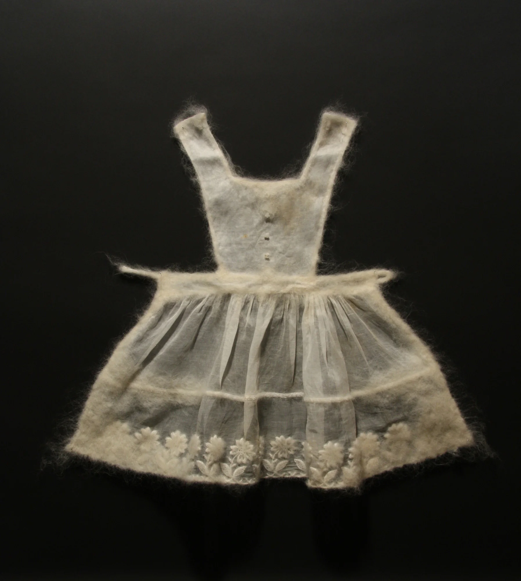 Apron , wool and found textiles, 23" x 31" x 2", 2009
