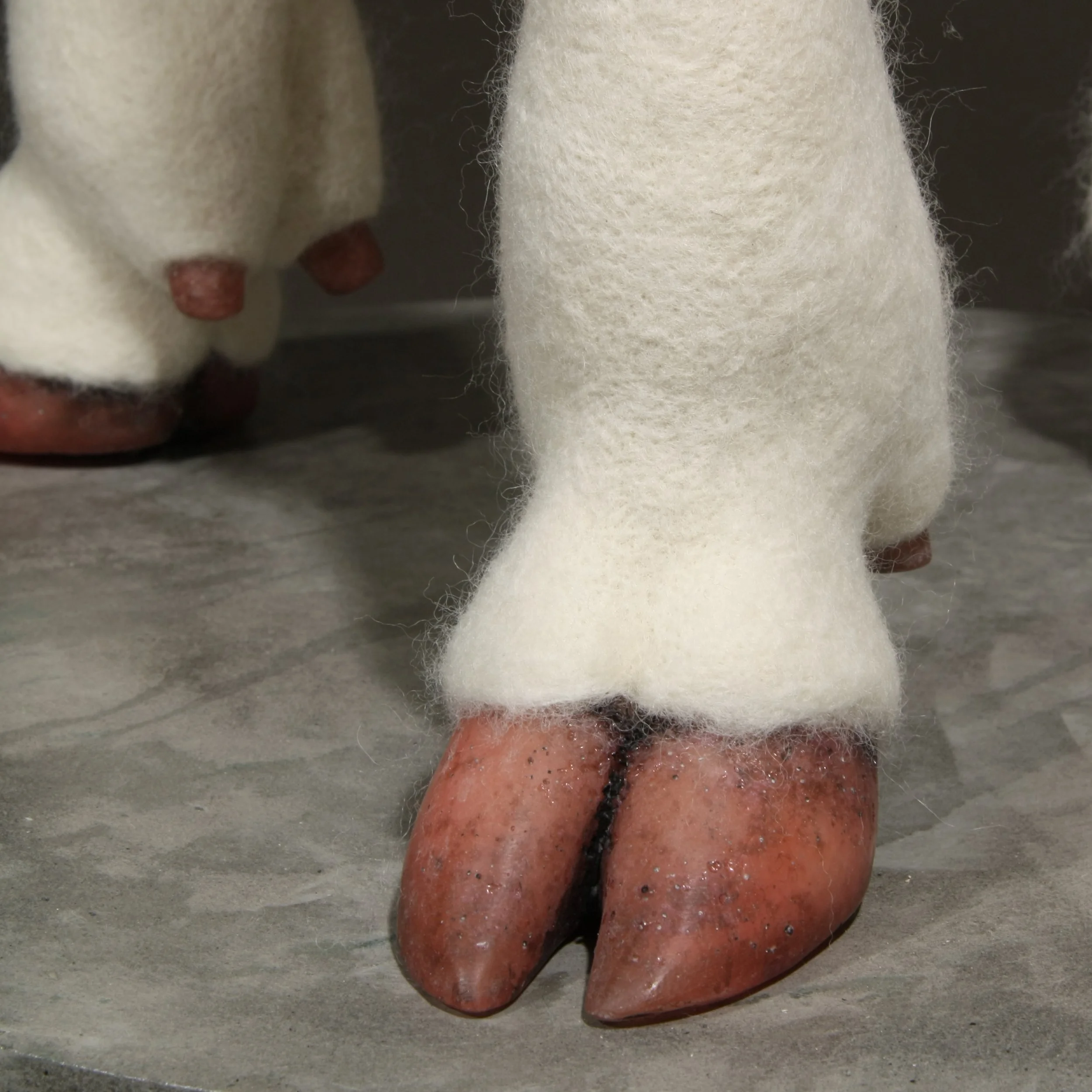    Acephala Mater , wool, industrial felt, polyurethane foam, resin, concrete, steel, 30" x 18.5" x 18.5", 2026.  