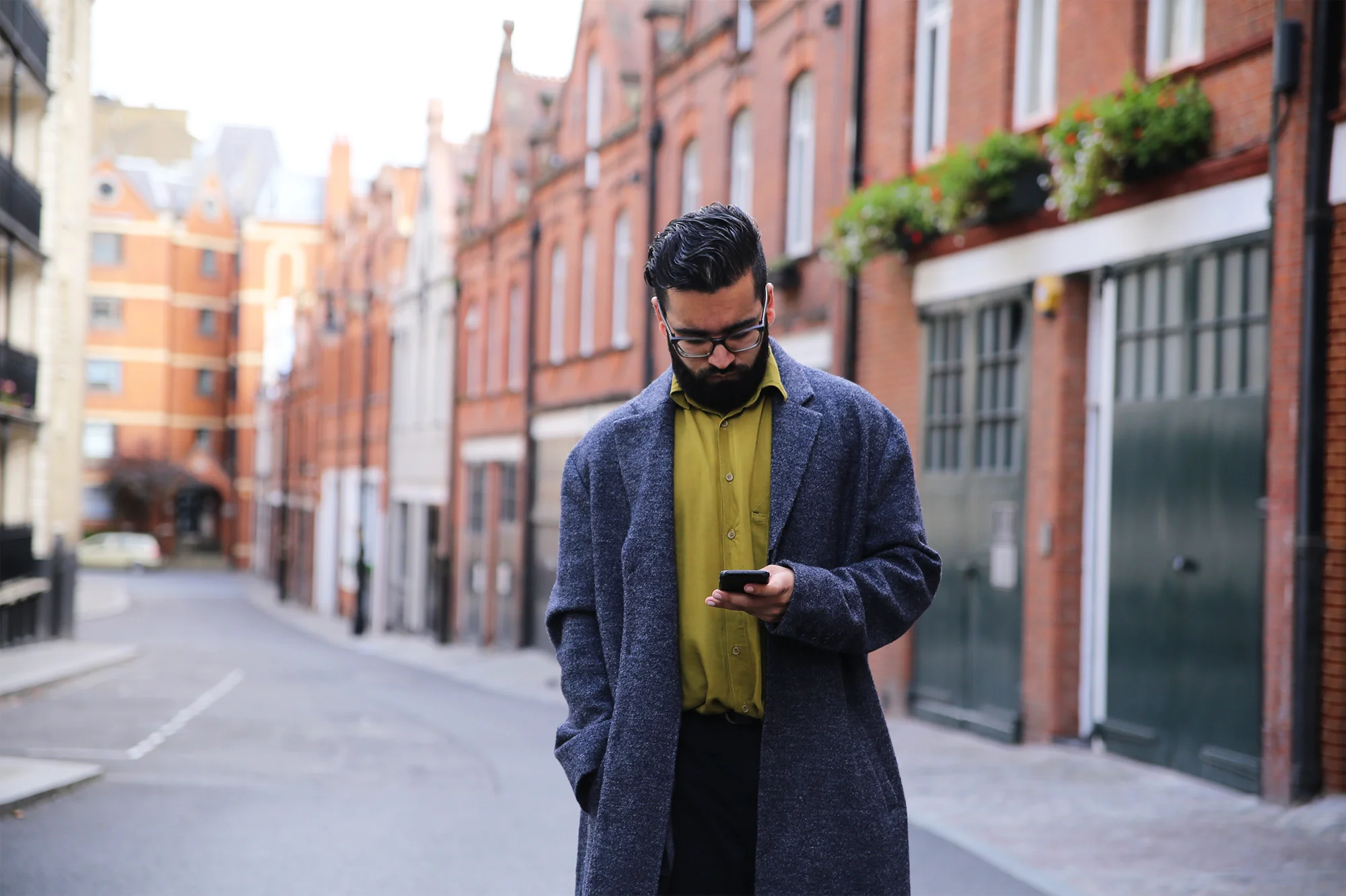 Glasses by Bulgari; Coat by Topman; Shirt is Vintage; Jeans by H&M; Shoes by Kurt Geiger. Images shot by Nic Roques .