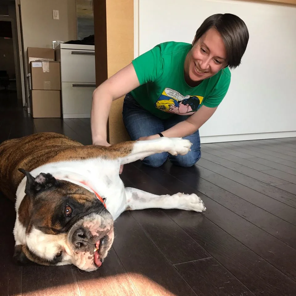 Michaud comforts her furry friend, Hank as she is trimming his nails // Image by MEAGHAN MICHAUD