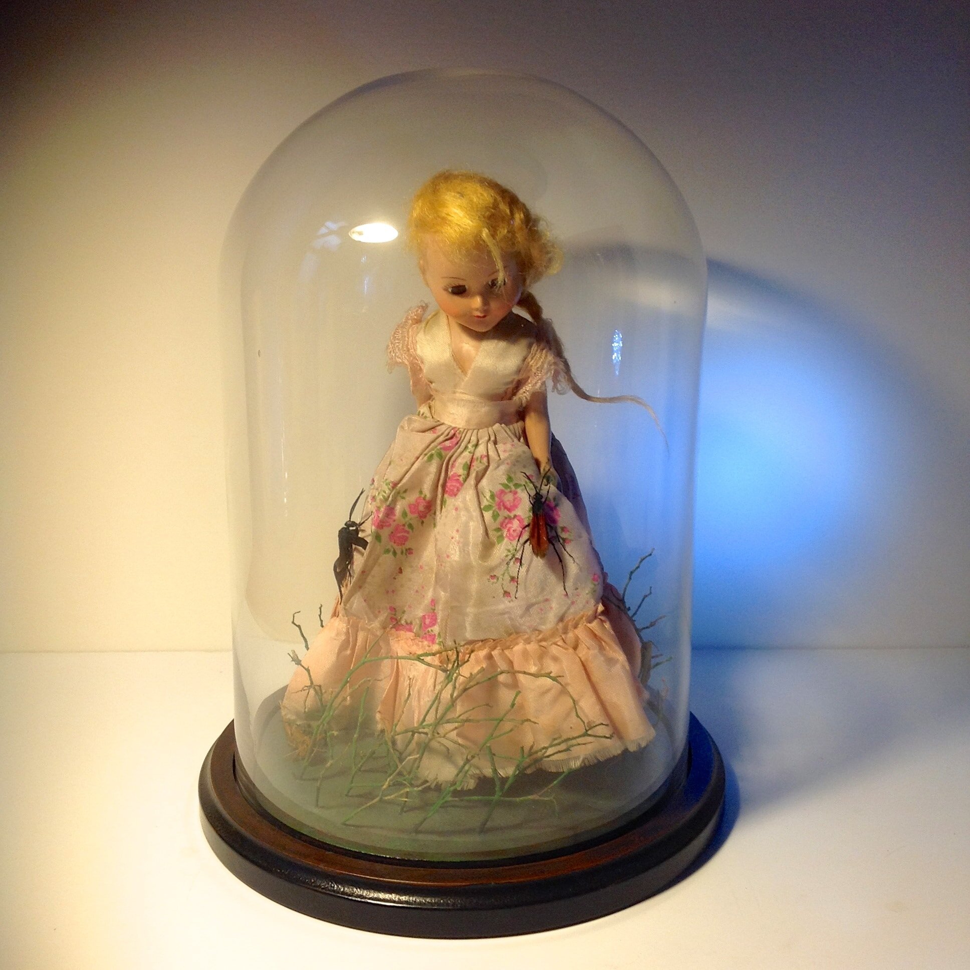 Figure in Pink Glass Dome