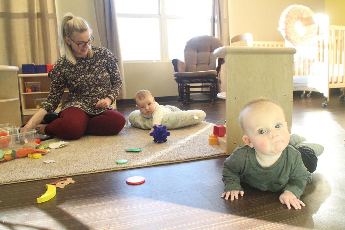 Big Apple Early Learning Academy is now open for new students, and already there are a group of infants who are exploring the bran-new building, under the watchful eyes of Teacher Gabby Lee.