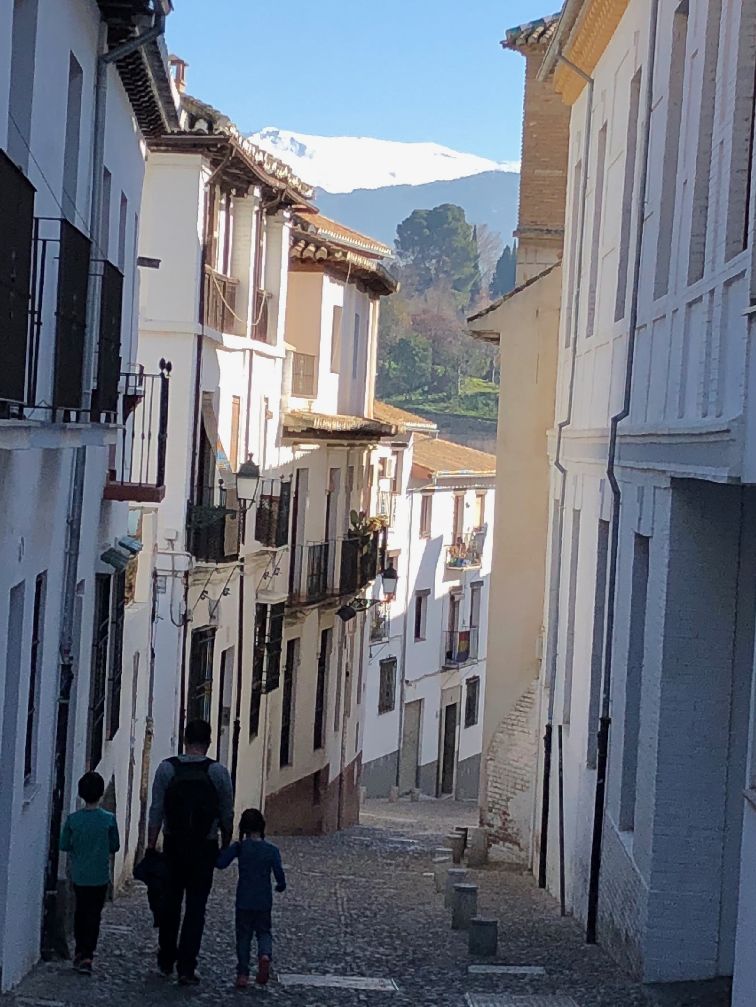 A stroll through the cobbled streets of Granada after our language class with the blue winter sky above and Sierra Nevada in the distance. Perfecto.