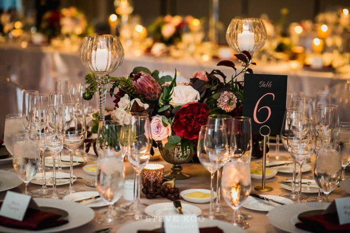 10-langham-wedding-steve-koo-photography-sweetchic-events-vale-of-enna-moody-romantic-wedding-centerpiece-low-and-lush-protea-gold-footed-vase-wine-black-rose