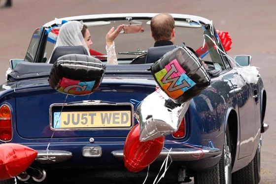 Newlywed Royals Leave Wedding Reception gettaway car aston martin Source