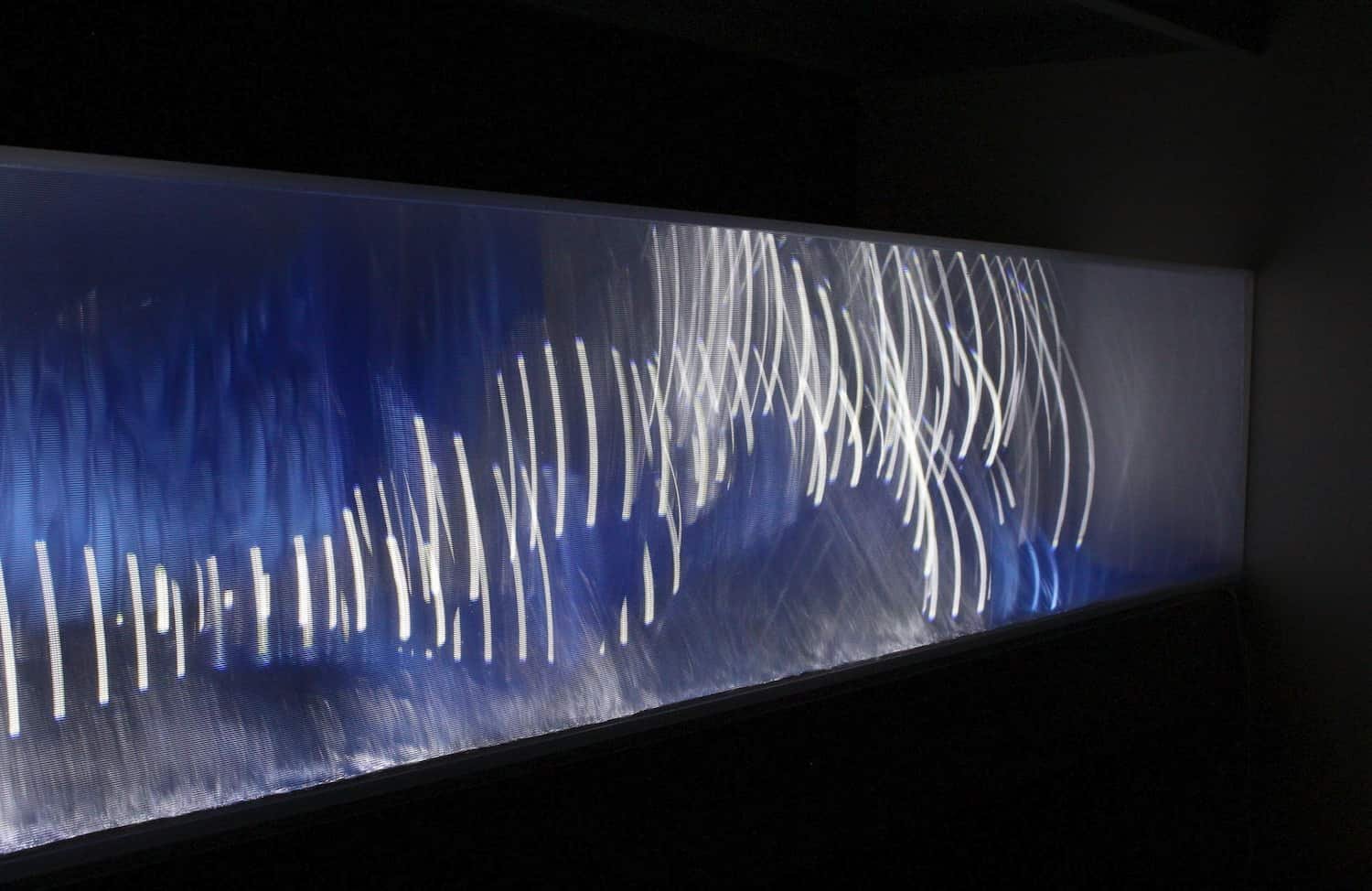 A sense of depth is created in the light sculpture through optical materials and LED lights.