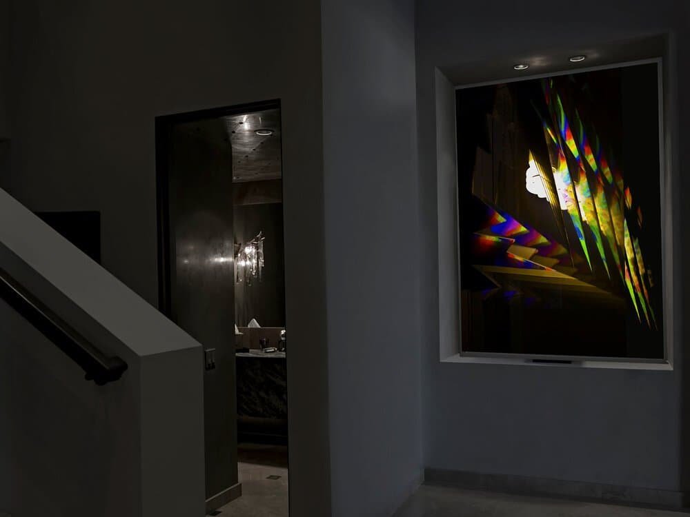 A light box portraying an infinite echo of a broken mirror, using light and reflective materials.