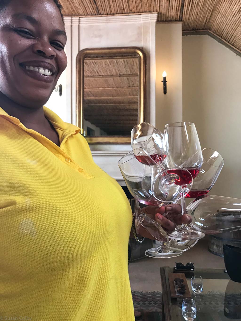 Our server at La Bri - note the clutch of wine glasses!