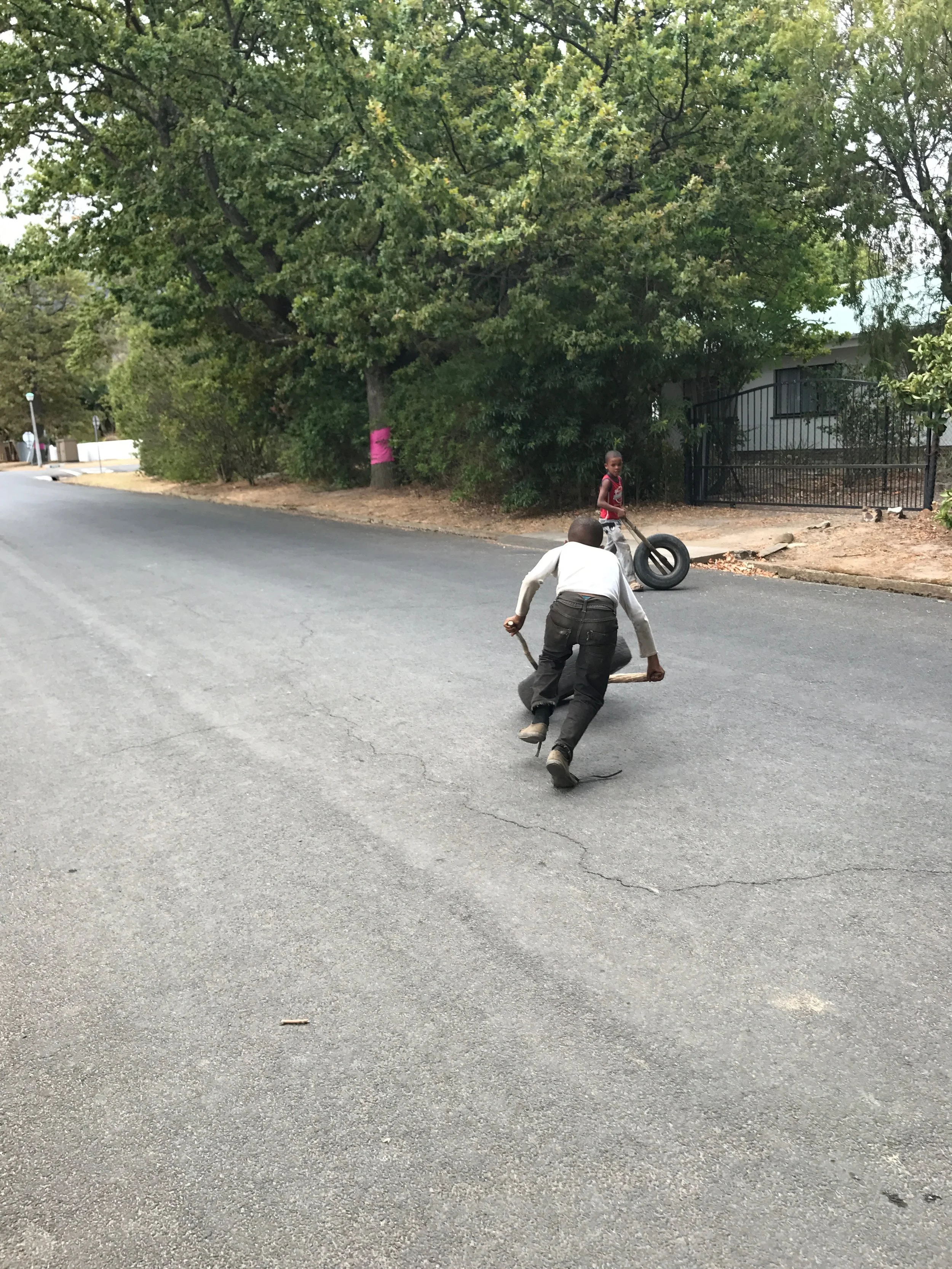 Young boys playing in the street