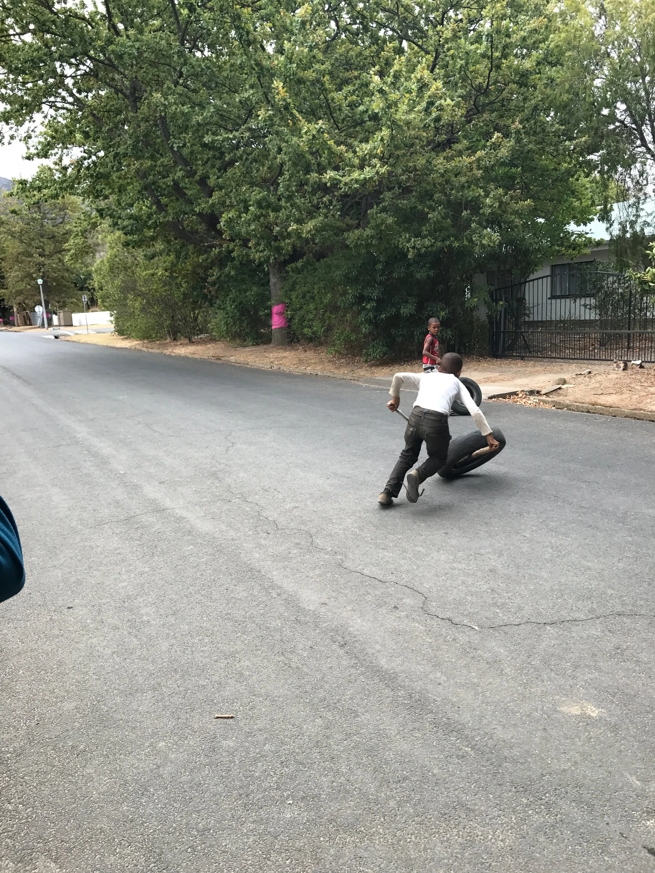 Young boys playing in the street