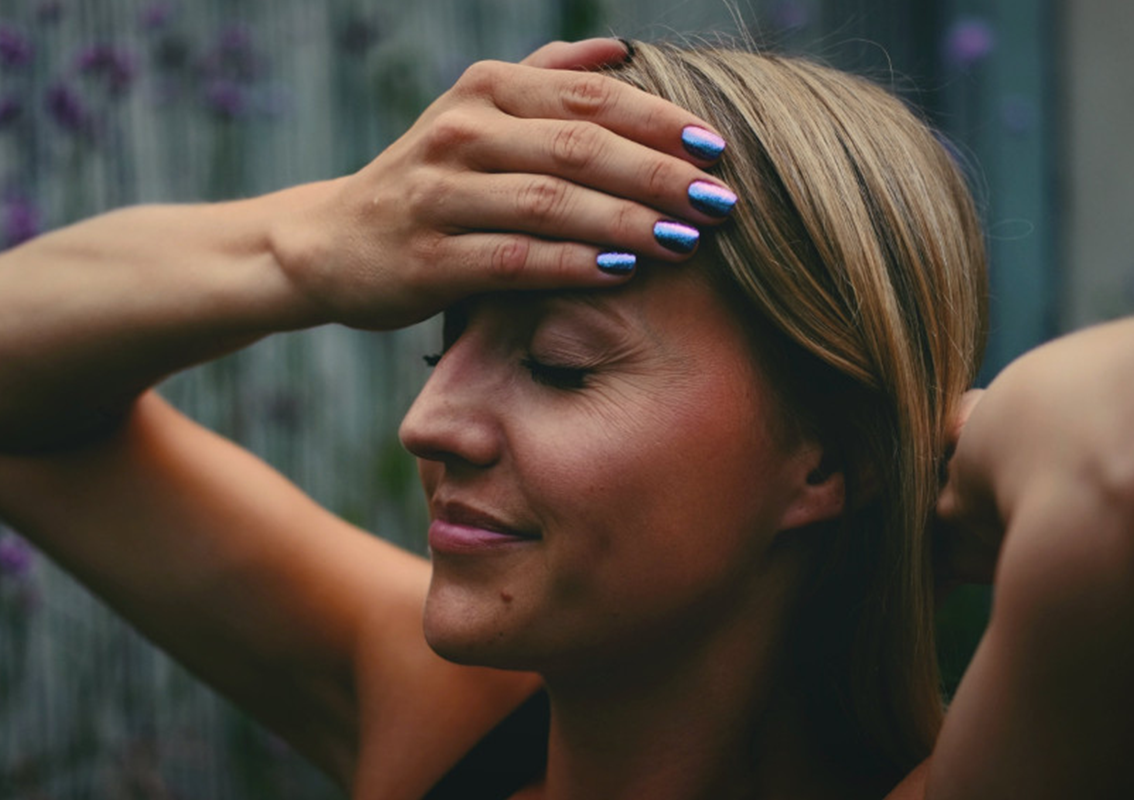 Woman meditating with calm nervous system, practicing manifestation and nervous system regulation