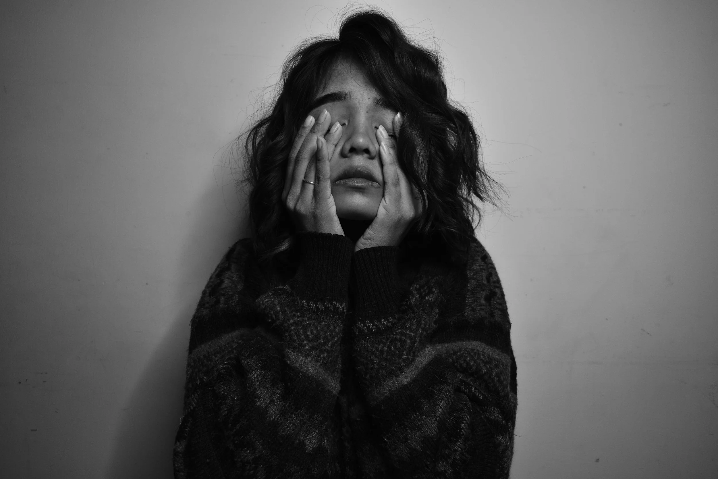 Woman feeling anxious and mentally exhausted due to ongoing stress