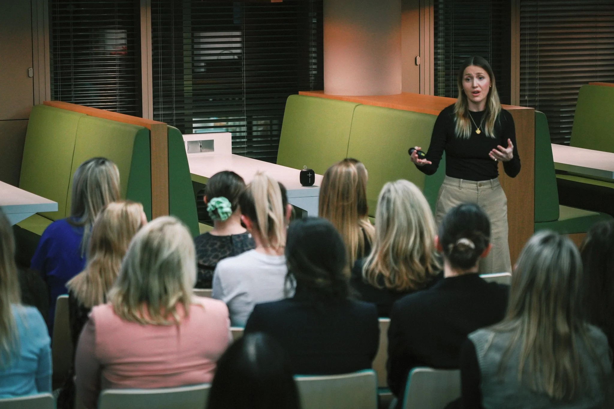 Kim Murray engaging the audience during a keynote speech about burnout