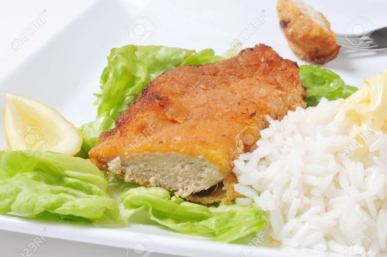 10658039-chicken-schnitzel-with-rice-lettuce-and-lemon-.jpg