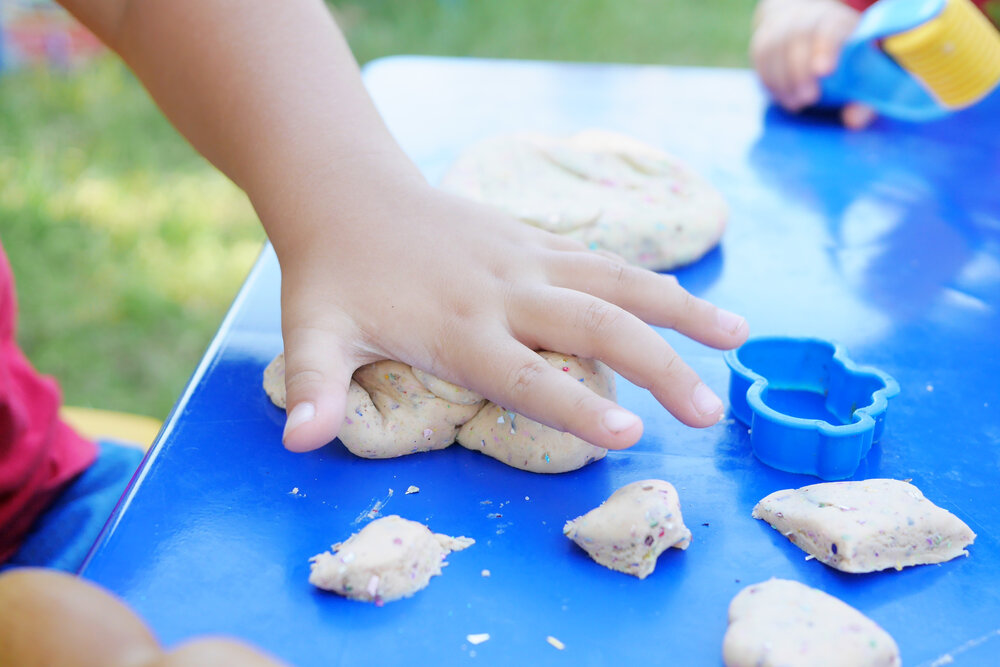 Canva - Photo of Child's Hand Playing Clay.jpg