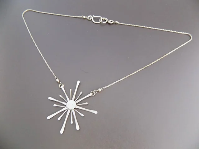 silver sun burst necklace.jpg