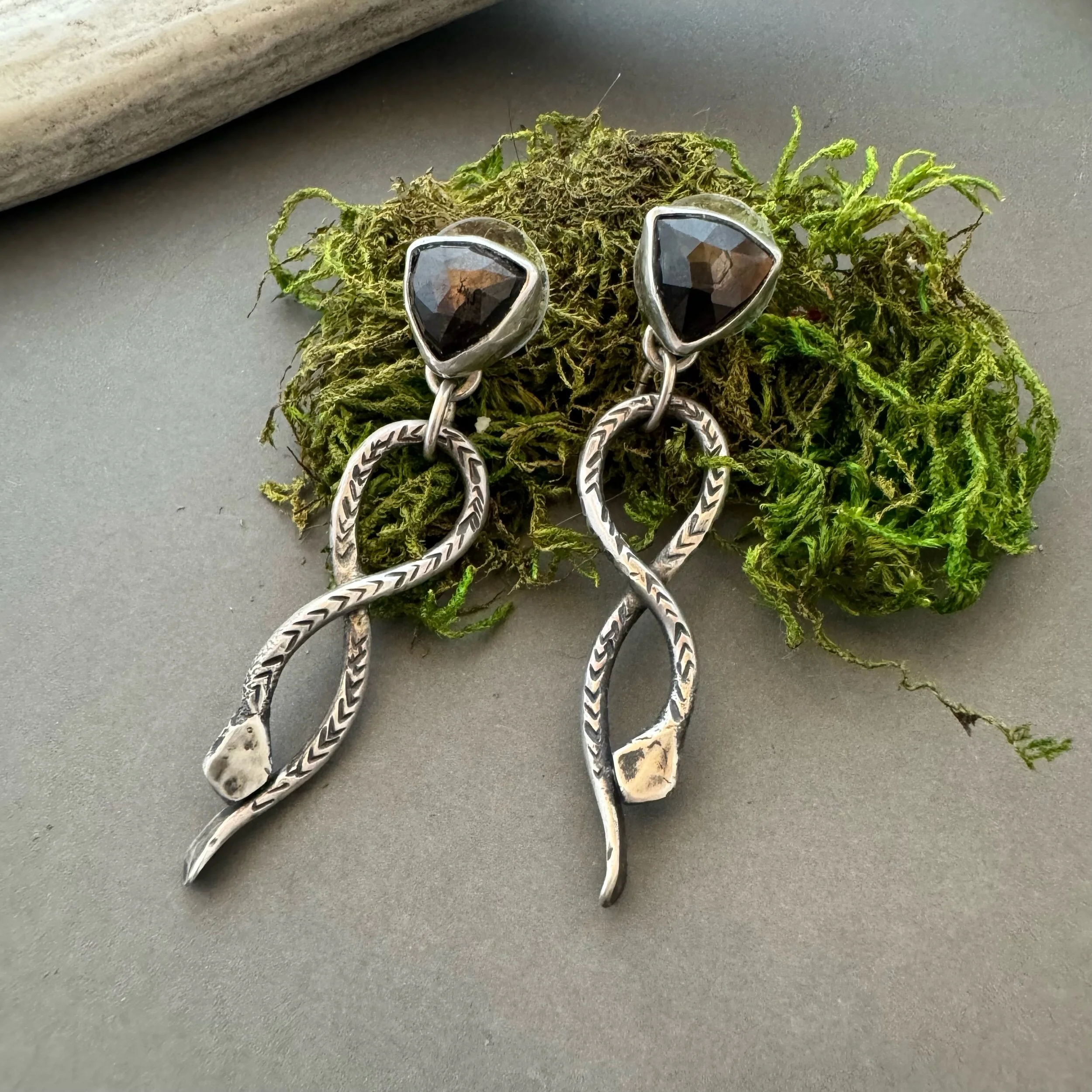 artisan earrings with star sapphire