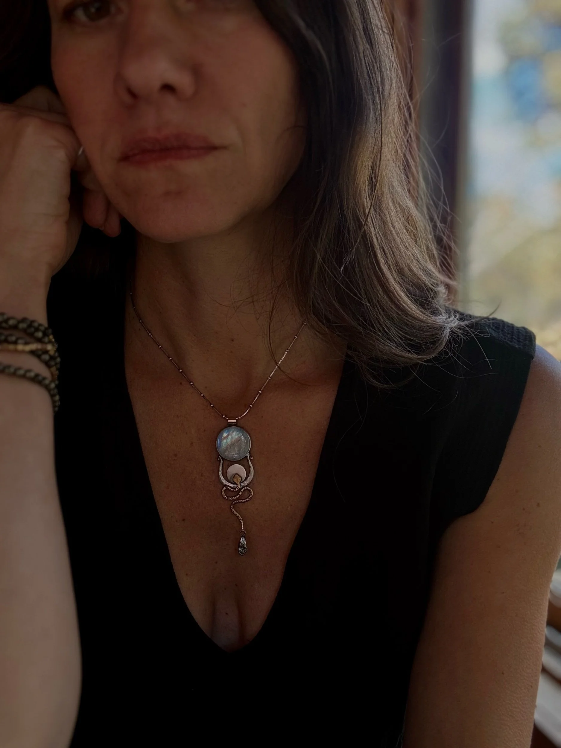 hand fabricated talisman necklace with moonstone and serpent for the woman rising