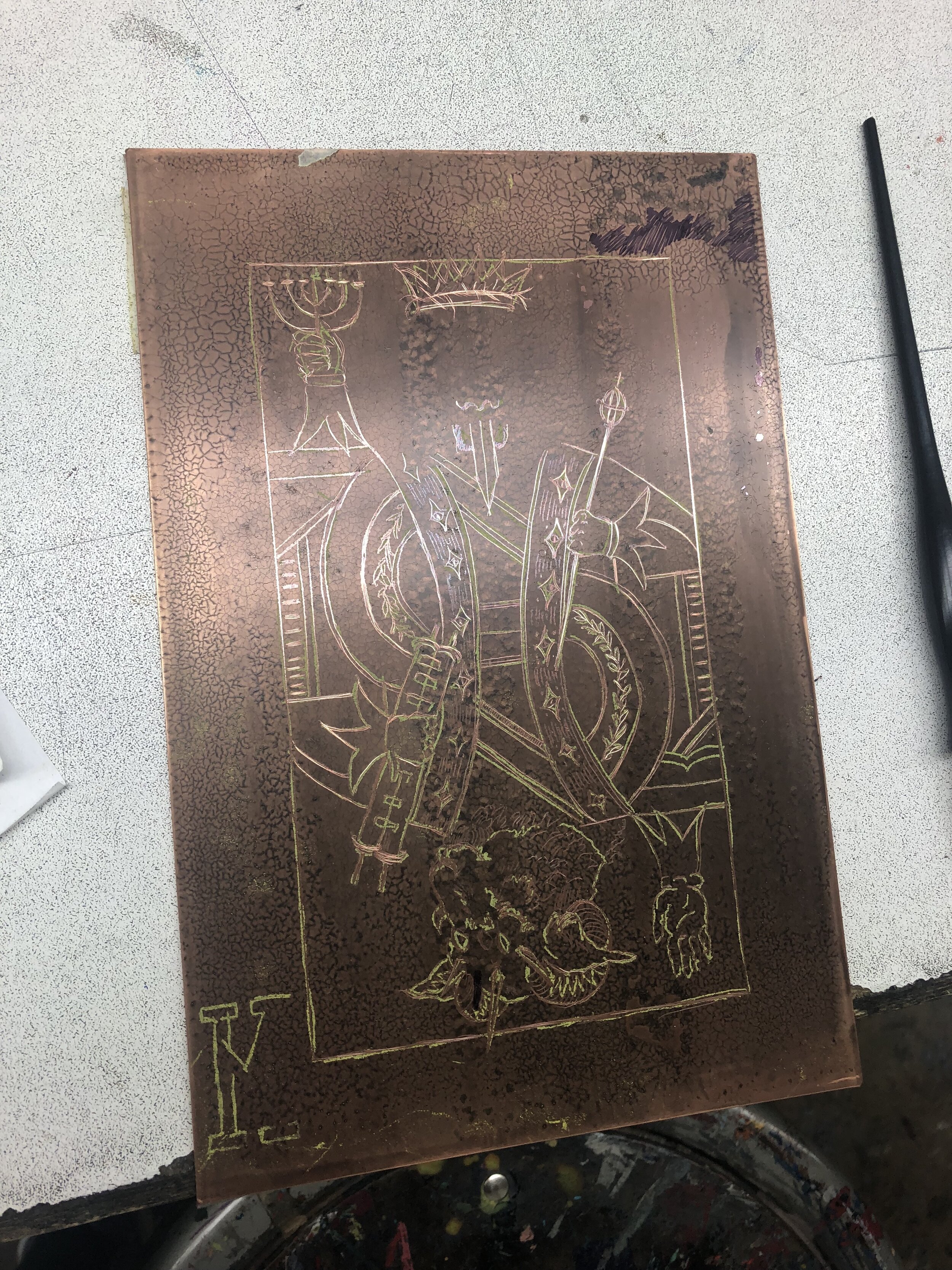  scratching out linework on first plate 