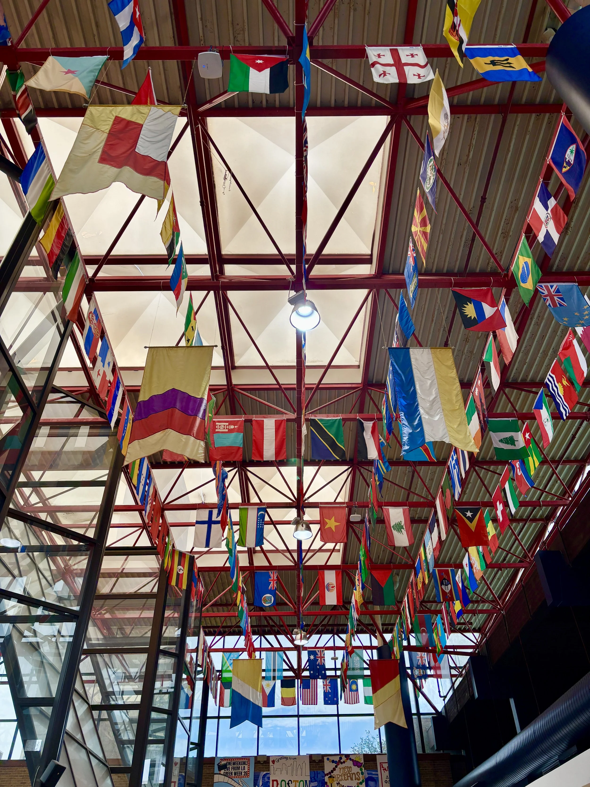International flags hanging from the ceiling at Hofstra U