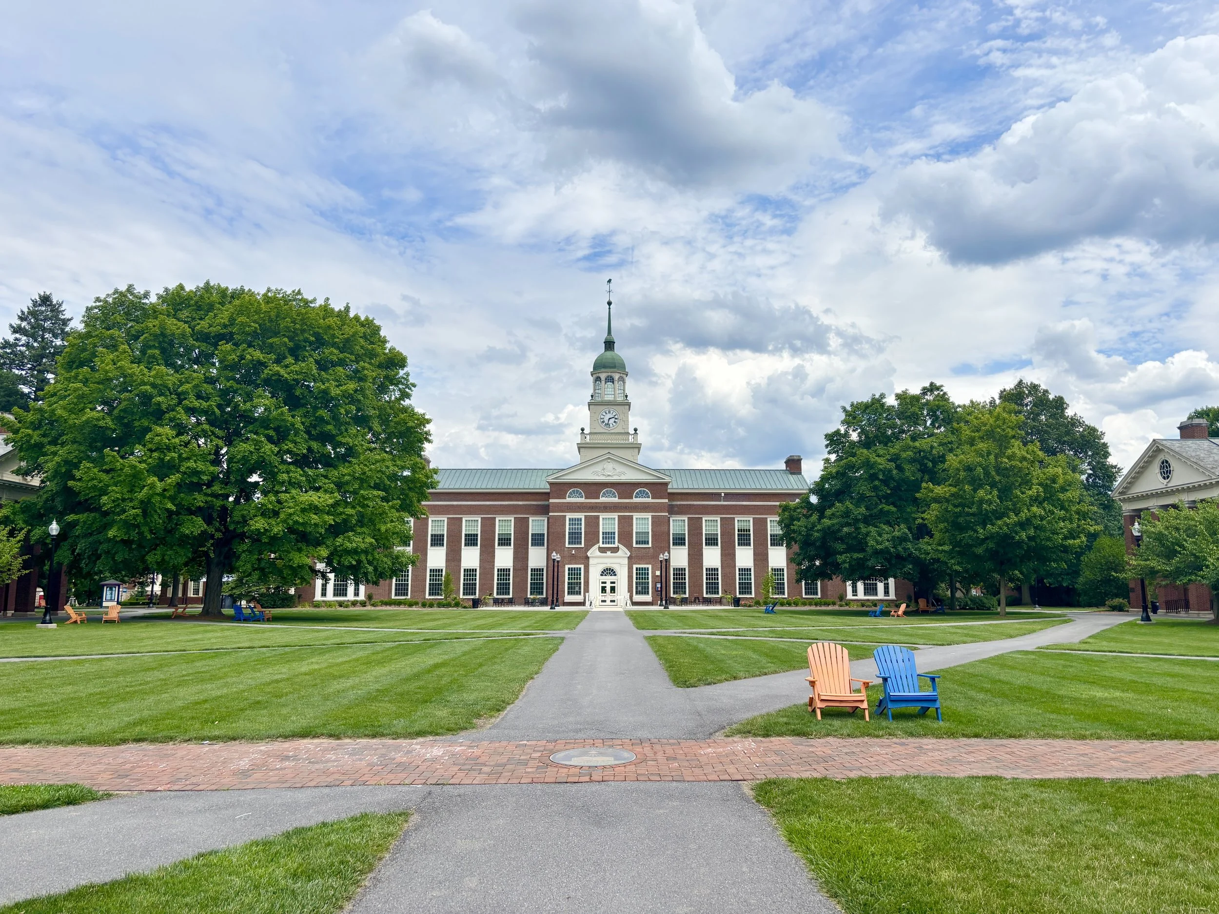 Bucknell building with adirondack chairs on the lawn