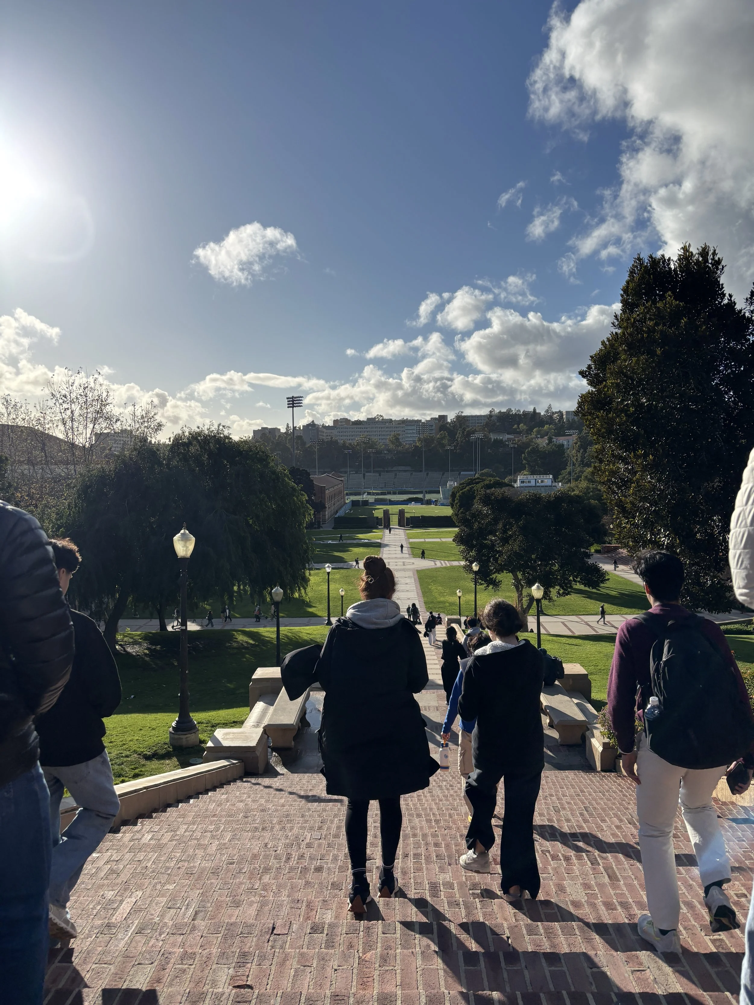 Students walking down an exterior staircase at UCLA