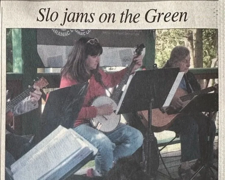 NEWSPAPER CLIPPING OF AUTHOR PLAYING HER BANJO