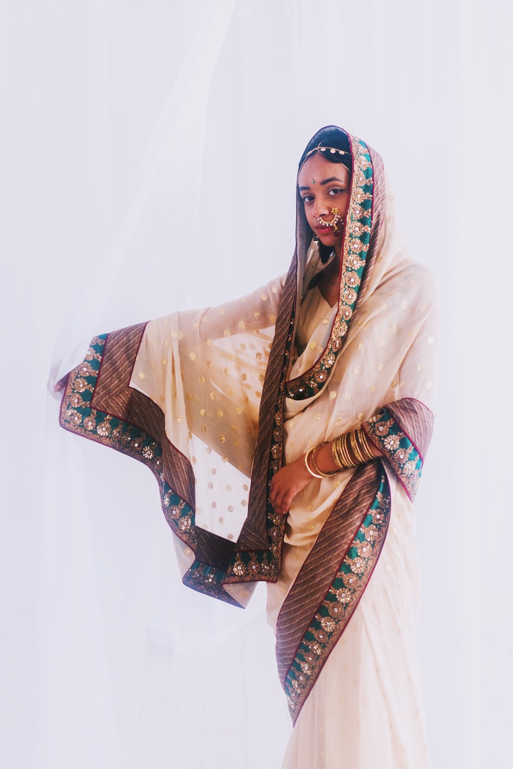 Janani Dev (she/her) - Sari (Sri Lanka) with Tunisian jewelry