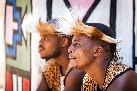 70159364-lesedi-cultural-village-south-africa-november-4-2016-two-young-male-zulu-tribe-members-wearing-tradi.jpg