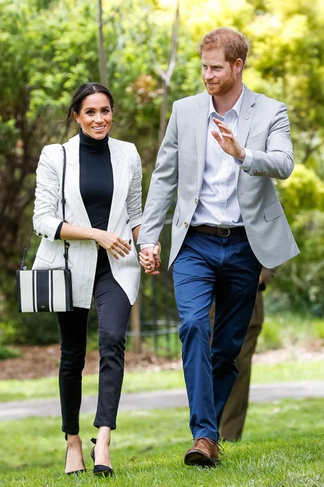 MEGHAN MARKLE wearing Outland Denim during the Royal Tour of Australia | photo by: Getty Images