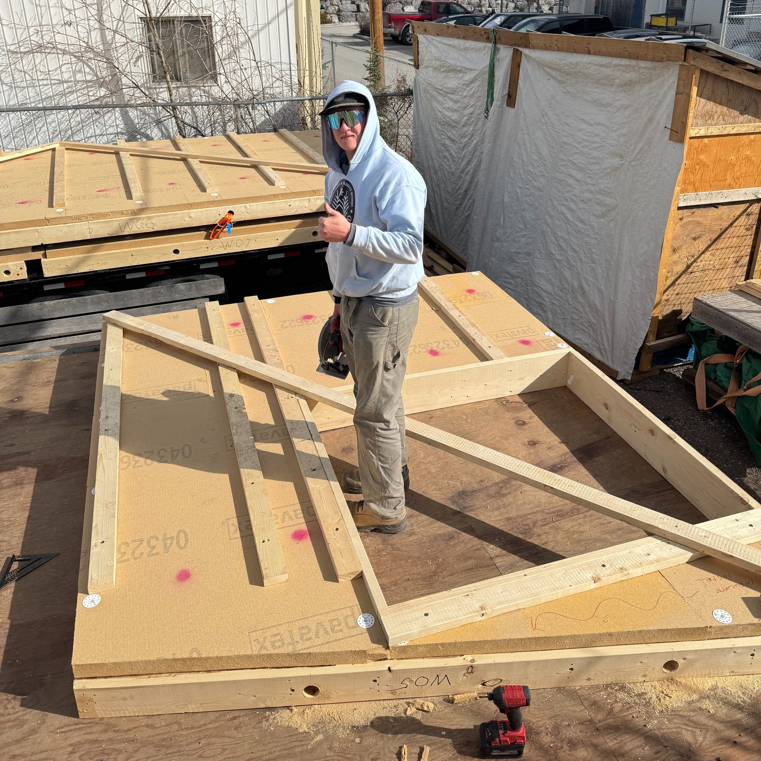 Pictured:  HSS Design Build Team member Brock finishes up a  PEER panel.
