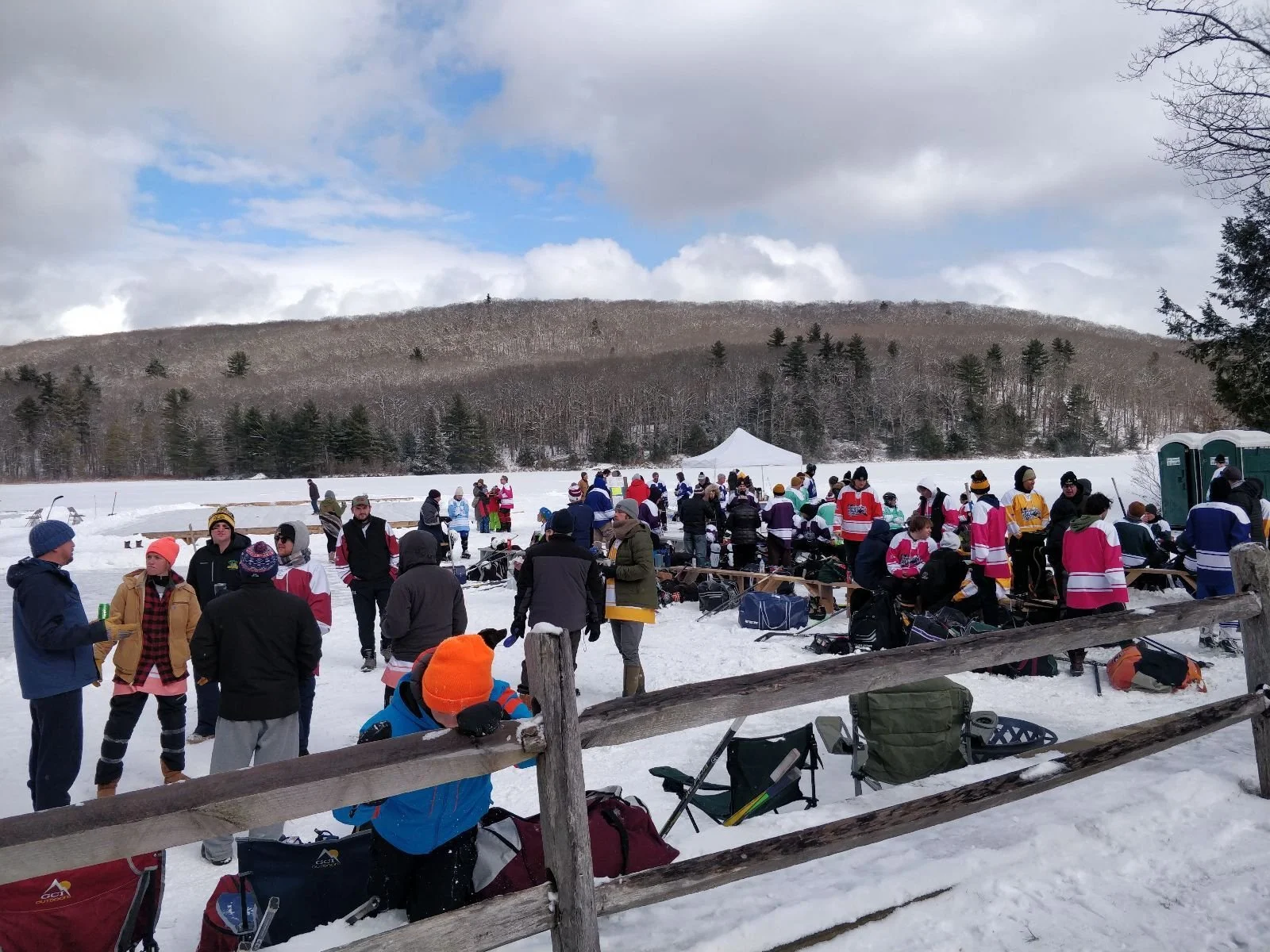 Crowd gathering at the Berkshire Pond Hockey Classic on Benedict Pond in the Berkshires organized by Alex Regen
