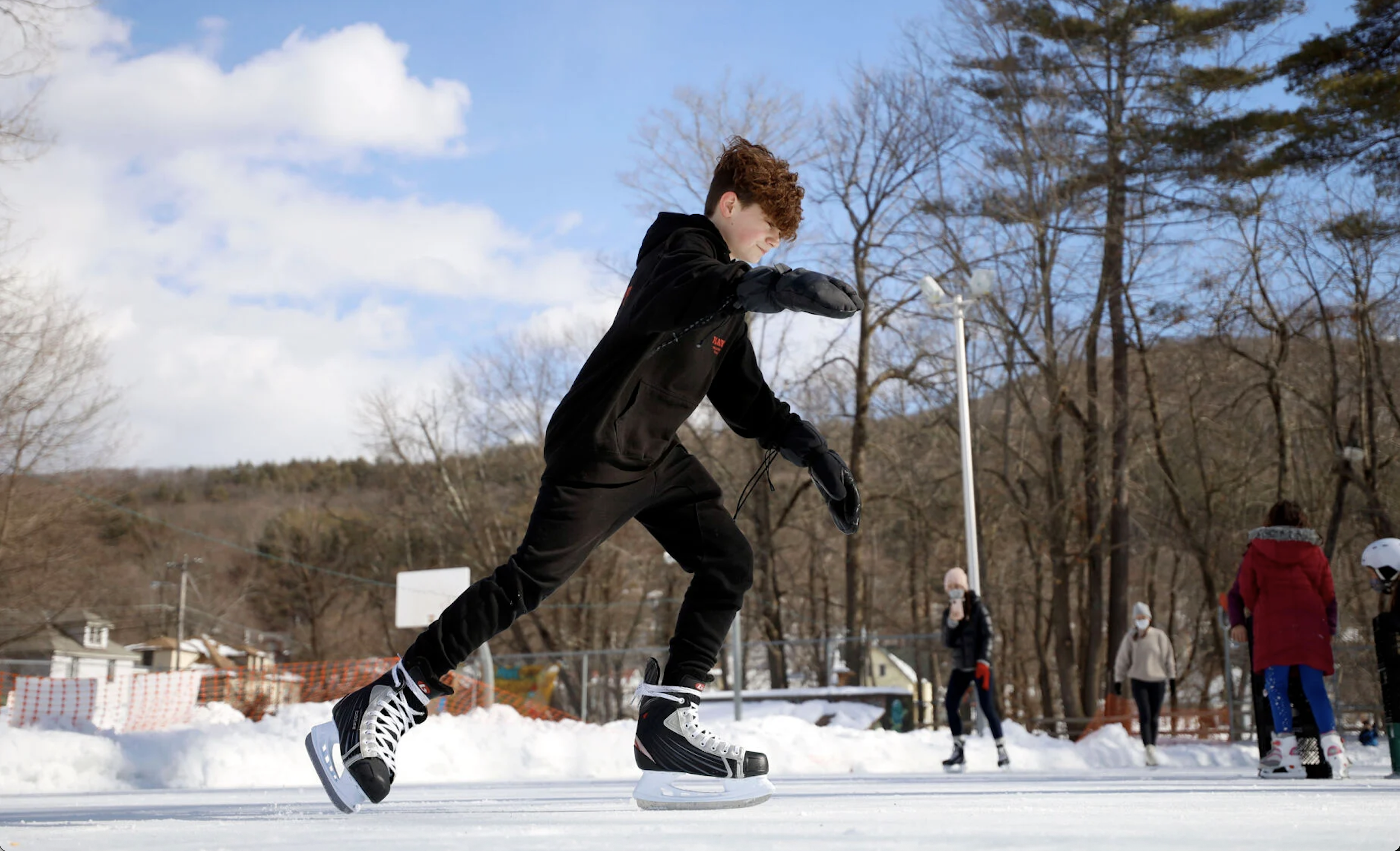 Community members skating at the Wahconah Park ice rink in Pittsfield, Massachusetts, a project led by Alex Regen