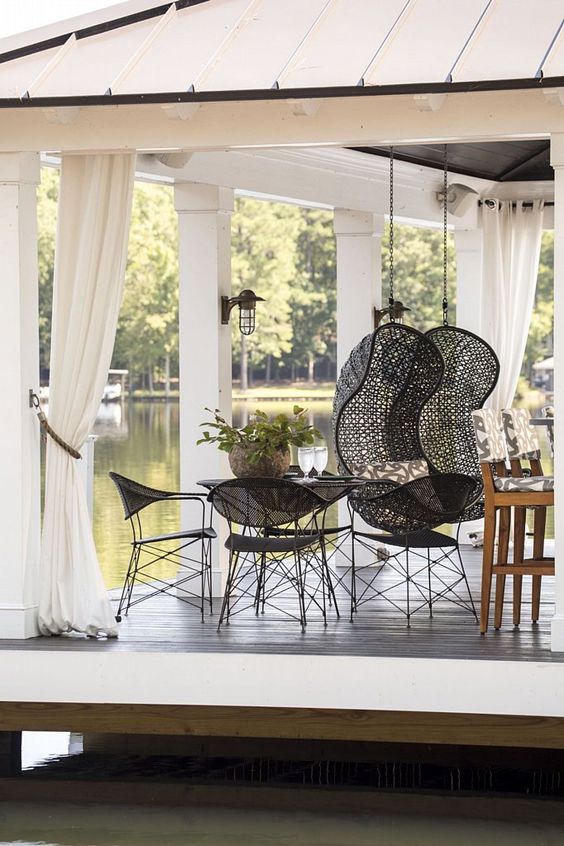 These gorgeous white ceiling to floor curtains are made with fabric by Sunbrella