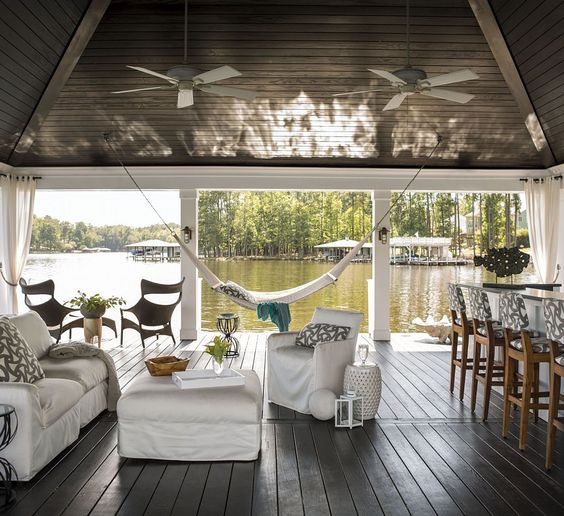 Heather Garrett interior design created the traditional boat dock with what’s become known as the “party dock”. The pillows and bar stool fabric is also by Sunbrella.