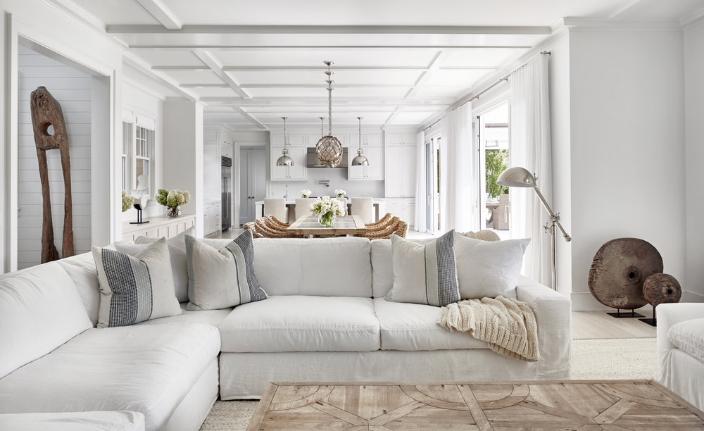 Such a cozy inviting family room...white slip covers and pillows by Chango & Co.