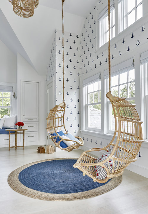 The kids can chill in these hanging wicker chairs from Serena & Lily , hopefully they share. This anchor wallpaper decor is precious for a boy's bedroom