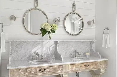 Vintage bathroom vanity is a refreshing look…with round port-hole inspired mirrors..