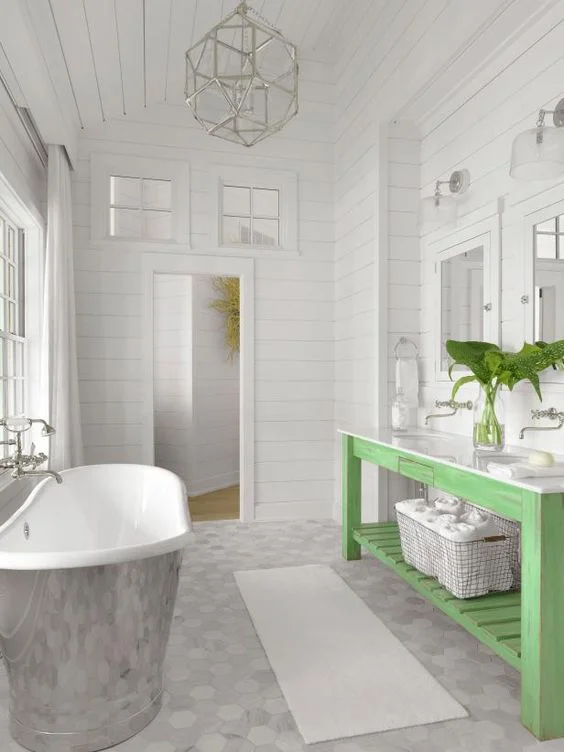This bathroom is so pretty, what a perfect spot to finish the day …soaking in a gorgeous bathtub as you overlook the stars shining on the lake… and the distressed wood bathroom vanity adds a visual pop of color…