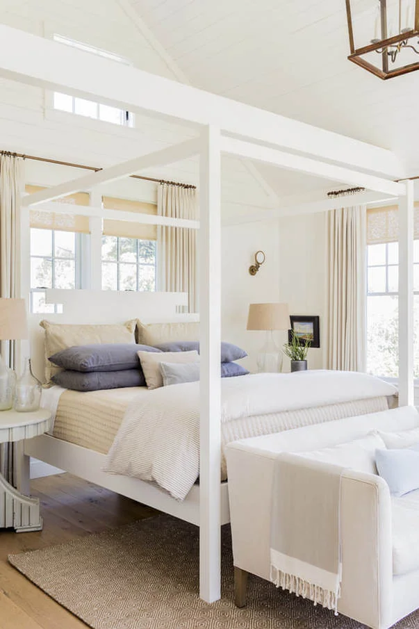 Formerly the garage, the new Master Suite includes sitting area, dressing hall and bath. The custom Mariner canopy bed, from Lisa Tharp Collection, evokes large dock cleats.