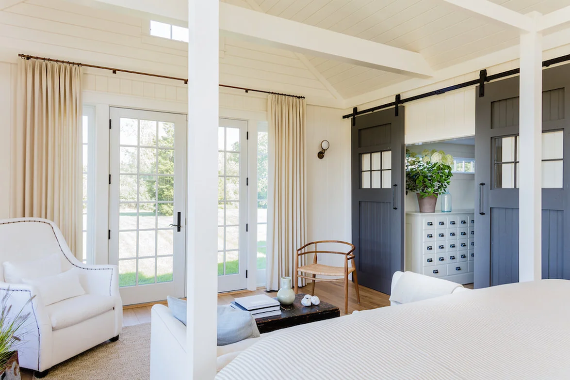 Reclaimed windows were repurposed into massive sliding doors.