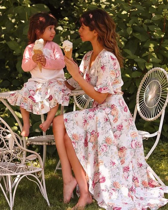 Wilder Fleur , creator of Mother Muse Mag , enjoying her afternoon with her daughter wearing matching floral dresses | Shop this designer .
