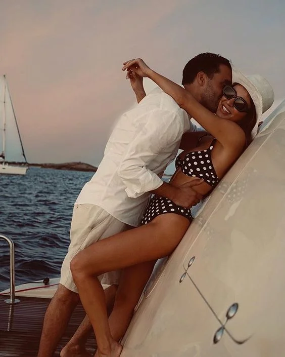 Negrin Mirsalehi looks classically beautiful and a blue-and-white polka dot bikini, and a cute sailor hat and stylish shades.
