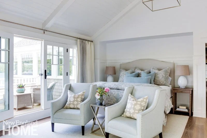 A master bedroom suite in a neutral color scheme with robin egg blue accents, added luxury is a your own private terrace to enjoy the tranquility and beauty of early mornings on the lake.