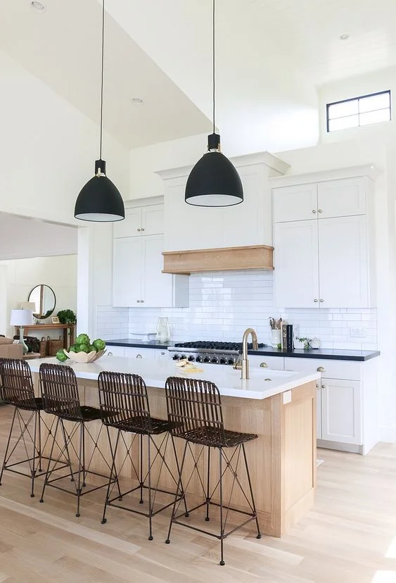“Modern Mountain”, Lindsey Hill Interiors designed this beautiful house in the mountains. The kitchen is designed using black and white color scheme with natural wood accents…Simple and chic with a modern touch. House Tour .