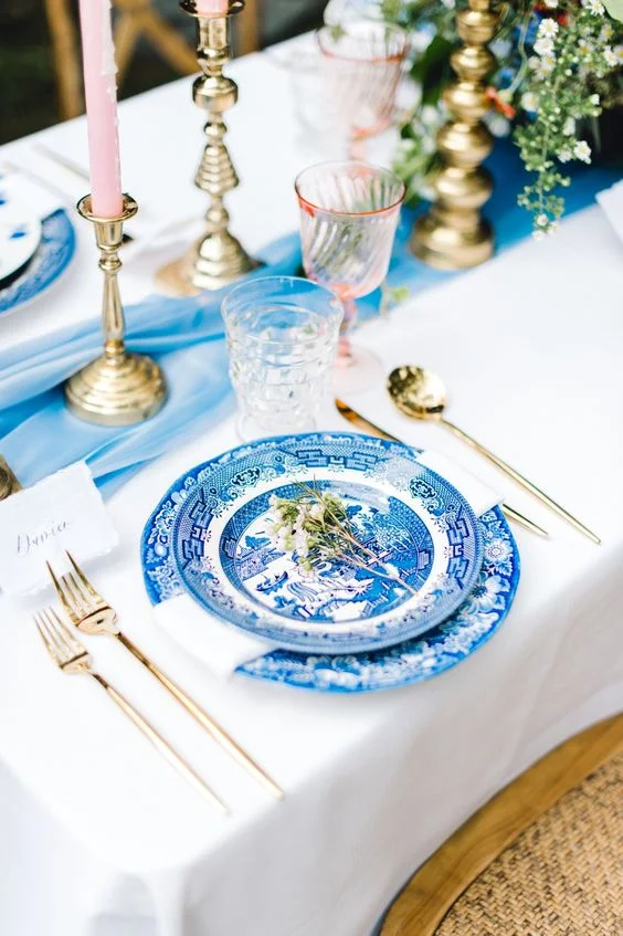 A timeless classic fresh blue + white table with light pink accents is a beautifully set table anytime of the year. via